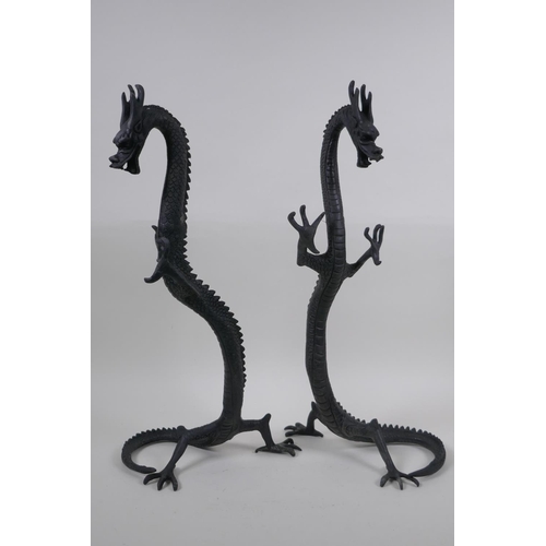 267 - A pair of Chinese bronzed metal dragons, 40 cm high