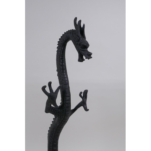 267 - A pair of Chinese bronzed metal dragons, 40 cm high