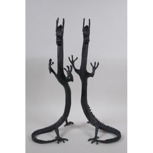 267 - A pair of Chinese bronzed metal dragons, 40 cm high