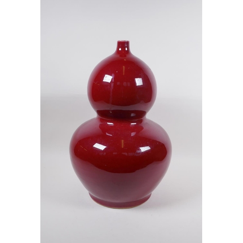 270 - A large Chinese flambe glazed porcelain double gourd vase, 4 character mark to base, 44cm high