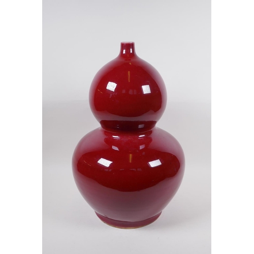 270 - A large Chinese flambe glazed porcelain double gourd vase, 4 character mark to base, 44cm high