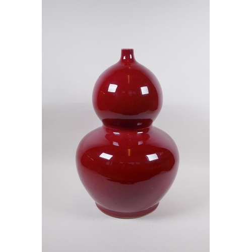 270 - A large Chinese flambe glazed porcelain double gourd vase, 4 character mark to base, 44cm high