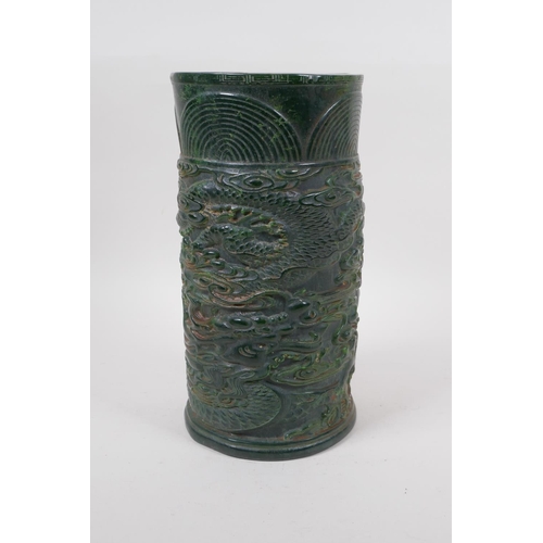 271 - A Chinese reconstituted green hardstone brush pot with dragon and flaming pearl decoration, mark to ... 