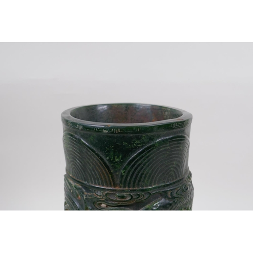 271 - A Chinese reconstituted green hardstone brush pot with dragon and flaming pearl decoration, mark to ... 