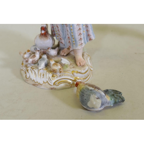 274 - A Royal Copenhagen porcelain figure of a goose girl, marked 12086, a continental porcelain pin cushi... 