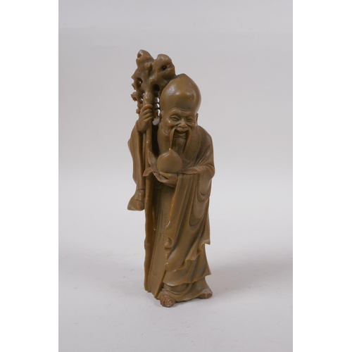 275 - A Chinese carved soapstone figure of Shou Lao, 19cm high, mark to base