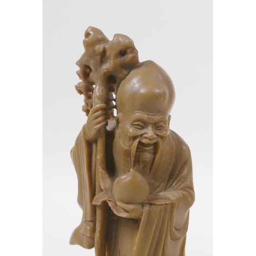 275 - A Chinese carved soapstone figure of Shou Lao, 19cm high, mark to base