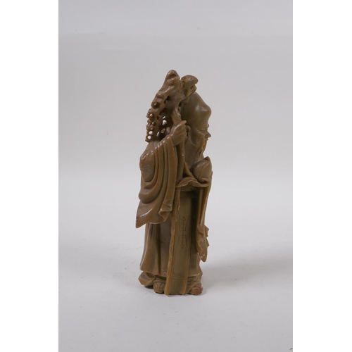 275 - A Chinese carved soapstone figure of Shou Lao, 19cm high, mark to base