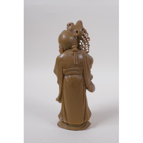 275 - A Chinese carved soapstone figure of Shou Lao, 19cm high, mark to base