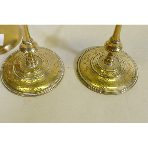 278 - A pair of C18th/C19th  brass candlesticks, possible French/Flemish, with engraved decoration, sconce... 