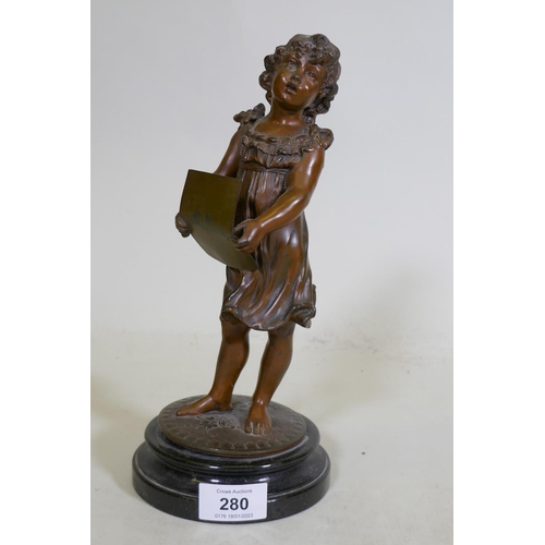 280 - A C19th bronzed spelter figure of a young girl singing from a song sheet, mounted on a marble base, ... 