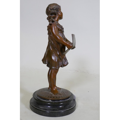 280 - A C19th bronzed spelter figure of a young girl singing from a song sheet, mounted on a marble base, ... 