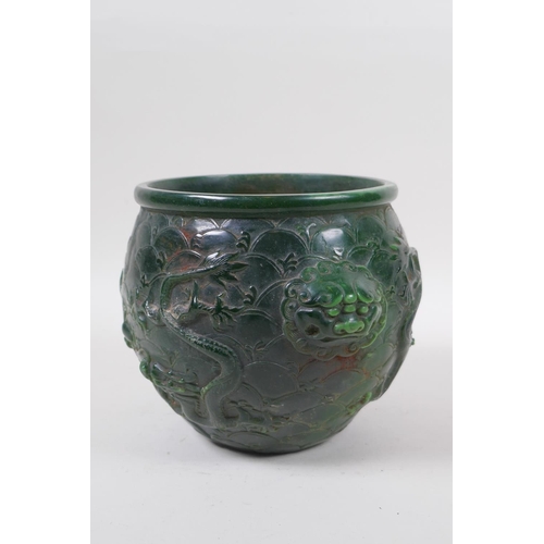 284 - A Chinese reconstituted green hardstone jar with two lion mask handles and raised dragon decoration