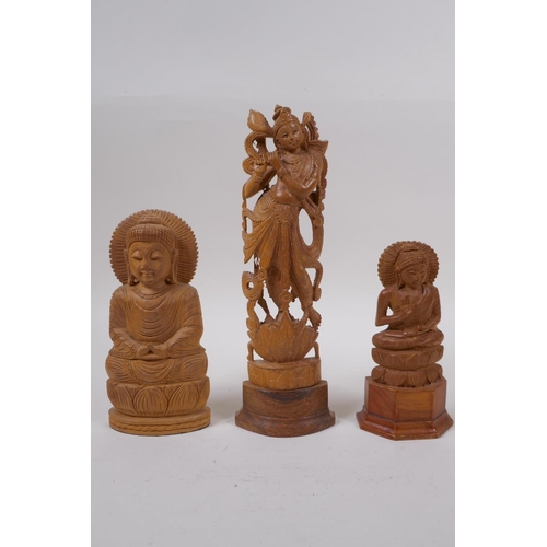 290 - An Indian boxwood carving of a dancer and another two carved in the form of Buddha, largest 23cm hig... 