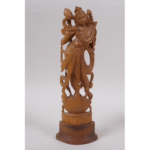 290 - An Indian boxwood carving of a dancer and another two carved in the form of Buddha, largest 23cm hig... 