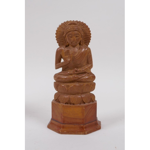 290 - An Indian boxwood carving of a dancer and another two carved in the form of Buddha, largest 23cm hig... 