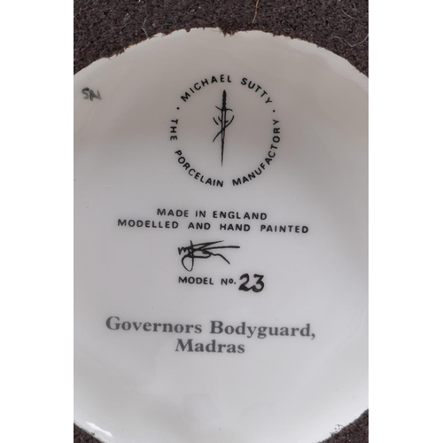 291 - Michael Sutty, porcelain military figure, No 23 Governors Bodyguard Madras initialled NS or SN, 29cm... 