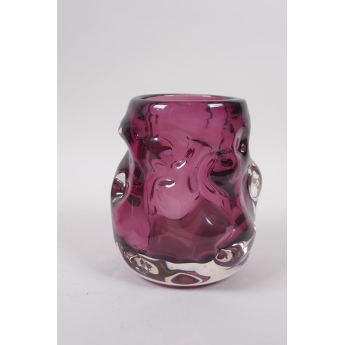 298 - An amethyst studio glass vase and a similar cranberry studio glass vase, largest 7½