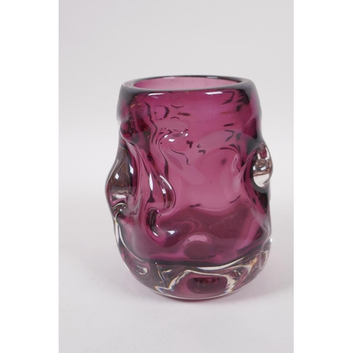 298 - An amethyst studio glass vase and a similar cranberry studio glass vase, largest 7½