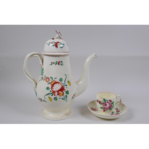 304 - A late C18th Staffordshire creamware teapot, cup and saucer, with flat reeded handles, flower moulde... 