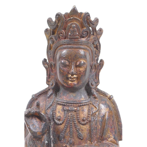 33 - A Sino Tibetan gilt bronze Buddha, seated on lotus flower, 25cm high