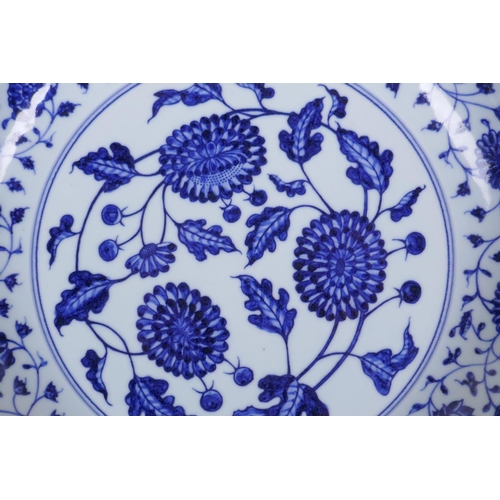 35 - A blue and white porcelain charger decorated with peonies, Chinese Xuande 6 character mark to side, ... 