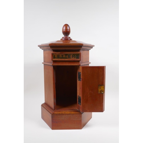 39 - A hexagonol fruitwood table postbox, 46cm high