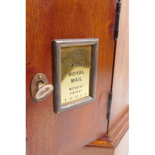 39 - A hexagonol fruitwood table postbox, 46cm high