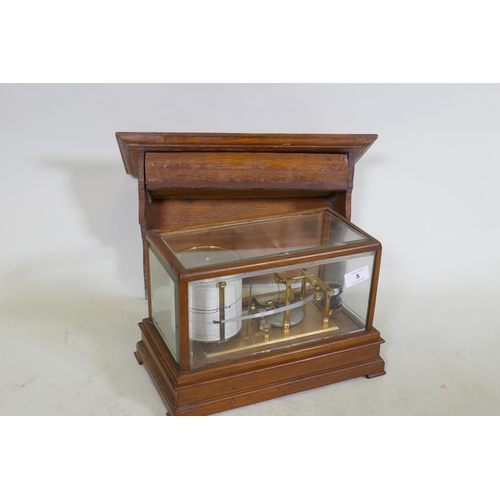 5 - A brass barograph in a glazed oak case with wall bracket fitted with a drawer, glass cracked, drawer... 