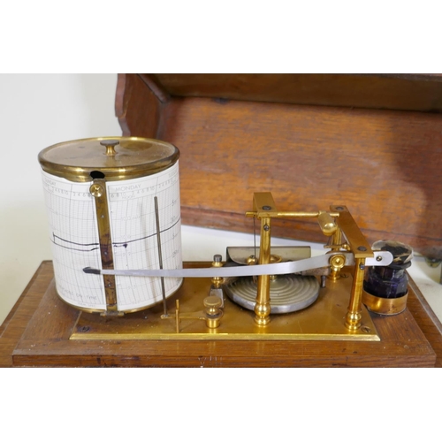 5 - A brass barograph in a glazed oak case with wall bracket fitted with a drawer, glass cracked, drawer... 