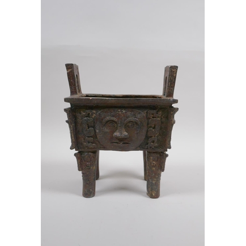 50 - A Chinese archaic style bronze censer with five handles and moonface decoration, 17 x 12cm, 20cm hig... 