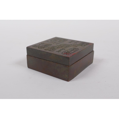 55 - A Chinese bronze ink box, the cover with impressed character marks, 6 x 6cm