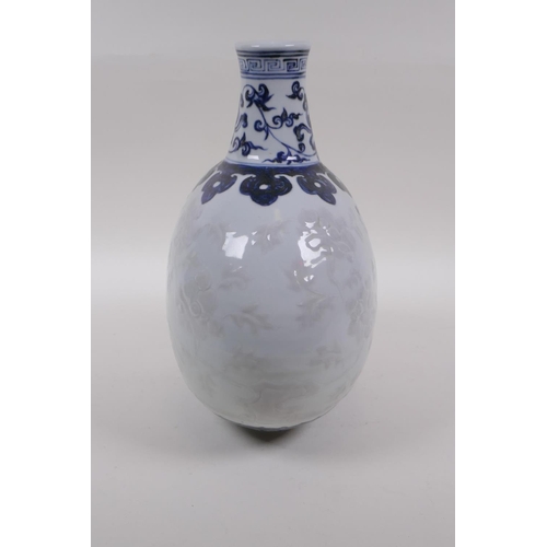 60 - A blue and white porcelain moon flask with raised phoenix decoration, Chinese Xuande 6 character mar... 