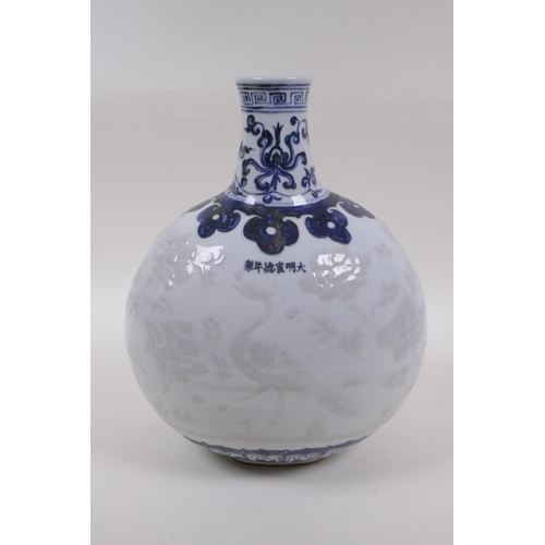 60 - A blue and white porcelain moon flask with raised phoenix decoration, Chinese Xuande 6 character mar... 