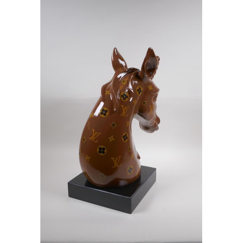 62 - A composition bust of a unicorn with LV style decoration, 45cm high