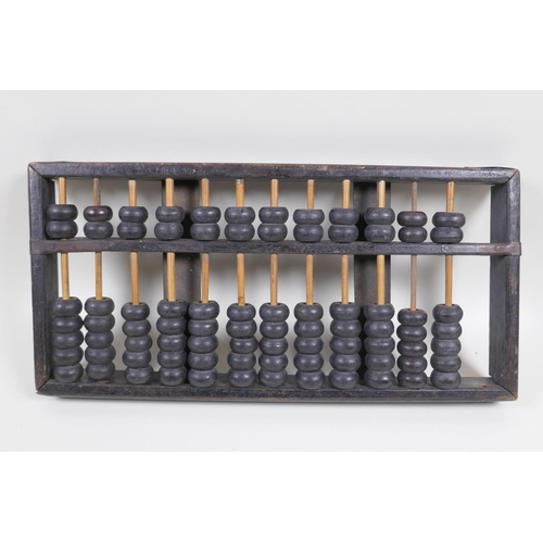 66 - A Chinese hardwood abacus with metal straps, 38 x 19cm