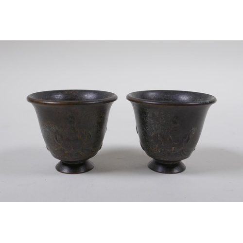 68 - A pair of Chinese bronze tea bowls, character marks to base, 4cm high, 5cm diameter