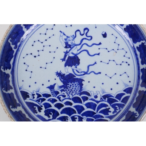 70 - A Chinese blue and white porcelain charger decorated with an immortal riding a carp, 29cm diameter