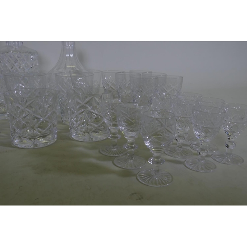 71 - Four cut glass decanters, a jug and various drinking glasses