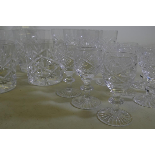 71 - Four cut glass decanters, a jug and various drinking glasses