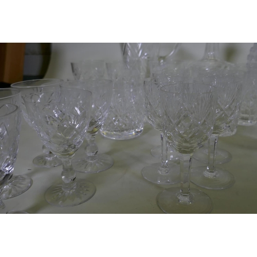 71 - Four cut glass decanters, a jug and various drinking glasses