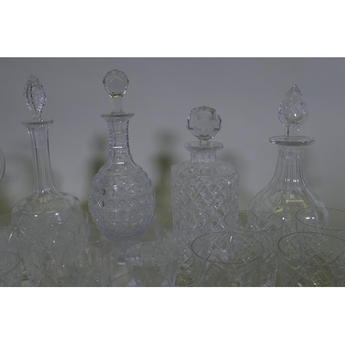 71 - Four cut glass decanters, a jug and various drinking glasses