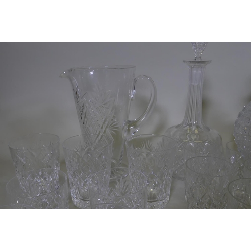 71 - Four cut glass decanters, a jug and various drinking glasses