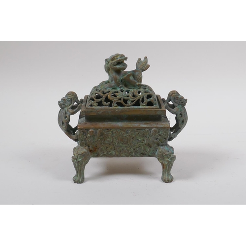 73 - A Chinese bronze censer and pierced cover with two handles and kylin knop, 6 character mark to base,... 