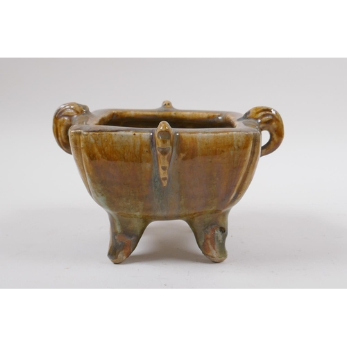 75 - A Chinese slip glazed pottery censer with two handles, impressed ring mark to base, 17 x 14cm, 11cm ... 