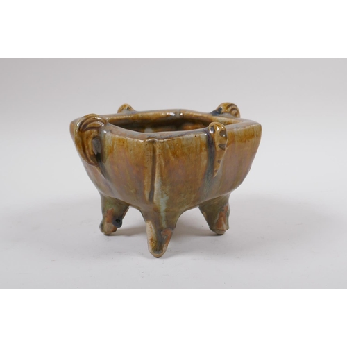 75 - A Chinese slip glazed pottery censer with two handles, impressed ring mark to base, 17 x 14cm, 11cm ... 