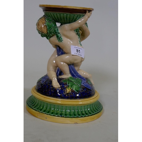 81 - A Victorian majolica centre piece stand in the form of two putti, in the style of Minton, 23cm high,... 