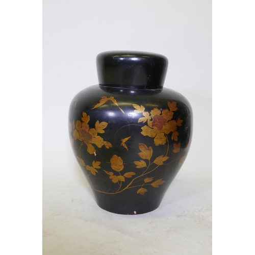 87 - An oriental lacquer storage jar, with internal cover and finely painted gilt decoration, 48cm high