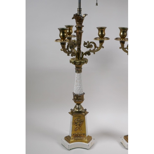 90 - A pair of painted and gilt white metal three branch table lamps converted to electricity, 84cm high