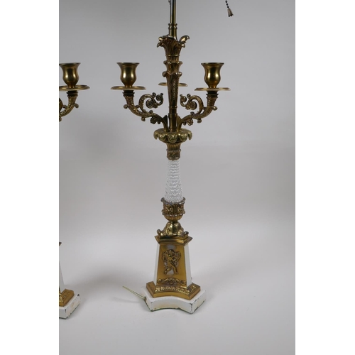 90 - A pair of painted and gilt white metal three branch table lamps converted to electricity, 84cm high